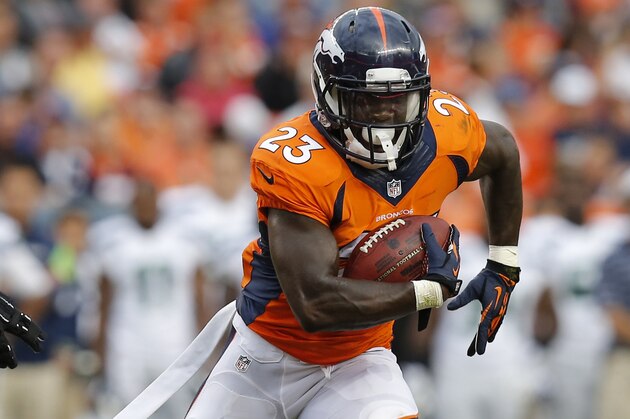 Denver Broncos running back Ronnie Hillman (23) runs against the Seattle Seahawks during the first half of an NFL preseason football game, Thursday, Aug. 7, 2014, in Denver. (AP Photo/Jack Dempsey)
