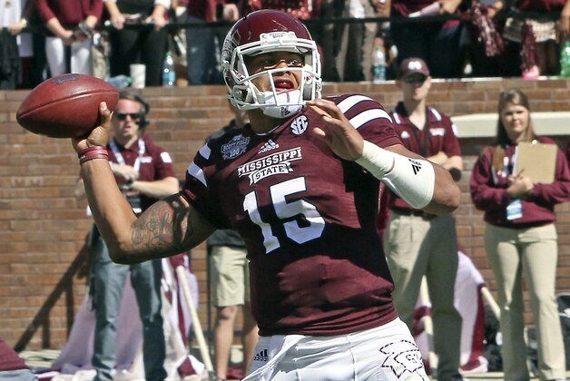 Mississippi State quarterback Dak Prescott (15) throws a pass during the second half of an NCAA college football game against Texas A&M in Starkville, Miss., Saturday, Oct. 4, 2014. MSU won 48-31. (AP Photo/Jim Lytle)