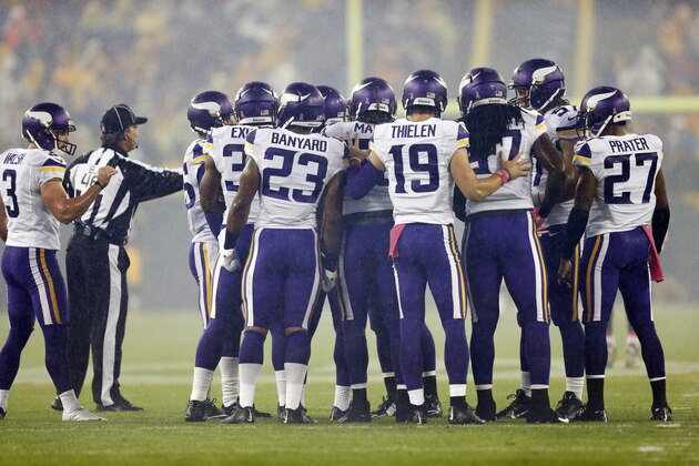 The Minnesota Vikings line up during the first half of an NFL football game against the Green Bay Packers Thursday, Oct. 2, 2014, in Green Bay, Wis. (AP Photo/Mike Roemer)
