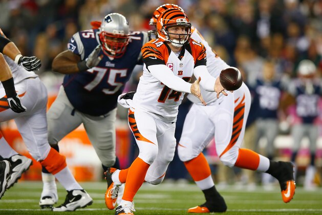 FOXBORO, MA - OCTOBER 05:  Andy Dalton #14 of the Cincinnati Bengals tosses the ball during the second quarter against the New England Patriots at Gillette Stadium on October 5, 2014 in Foxboro, Massachusetts.  (Photo by Jared Wickerham/Getty Images)