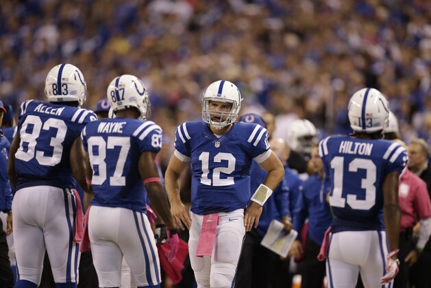Indianapolis Colts quarterback Andrew Luck (12) int he huddle during the second half of an NFL football game against the Baltimore Ravens in Indianapolis, Sunday, Oct. 5, 2014. (AP Photo/AJ Mast)