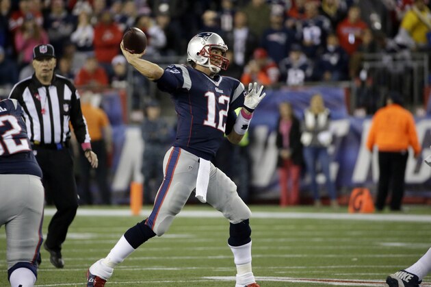 New England Patriots quarterback Tom Brady throws a pass to New England Patriots tight end Rob Gronkowski in the first half of an NFL football game against the Cincinnati Bengals Sunday, Oct. 5, 2014, in Foxborough, Mass. With the completion, Brady becomes the sixth quarterback in NFL history to throw for 50,000 career passing yards.(AP Photo/Stephan Savoia)
