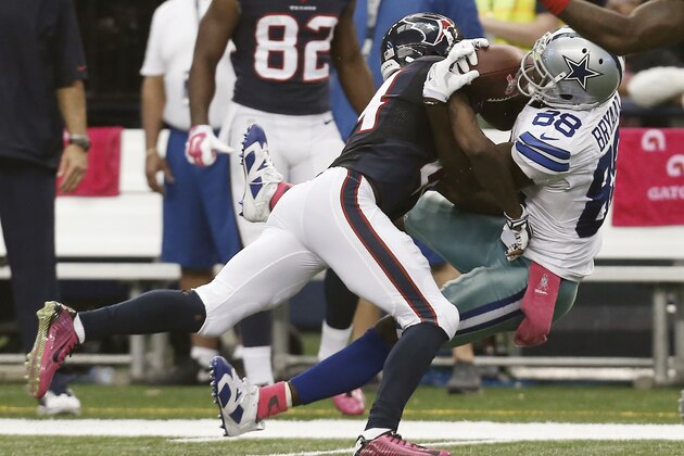 Dallas Cowboys wide receiver Dez Bryant (88) catches a pass as Houston Texans cornerback Johnathan Joseph (24) defends during the second half of an NFL football game, Sunday, Oct. 5, 2014, in Arlington, Texas. Bryant's catch setup kicker Dan Bailey to kick the game winning field goal in overtime. Dallas won 20-17. (AP Photo/Brandon Wade)