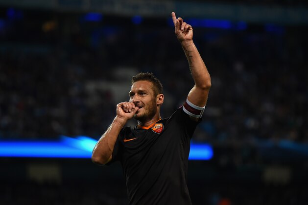 MANCHESTER, ENGLAND - SEPTEMBER 30:  Francesco Totti of AS Roma celebrates scoring his team's first goal during the UEFA Champions League Group E match between Manchester City FC and AS Roma  on September 30, 2014 in Manchester, United Kingdom.  (Photo by Laurence Griffiths/Getty Images)