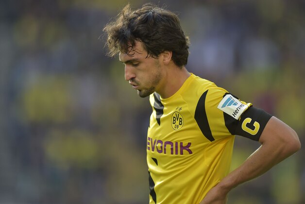 Dortmund's Mats Hummels reacts during the German Bundesliga soccer match between Borussia Dortmund and Hamburger SV in Dortmund, Germany, Saturday, Oct. 4, 2014. Dortmund was defeated by Hamburg with 0-1. (AP Photo/Martin Meissner)
