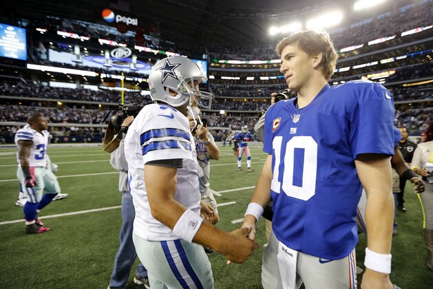 Dallas Cowboys' Tony Romo (9) and Eli Manning, right, greet each other after their NFL football game Sunday, Oct. 28, 2012, in Arlington, Texas. The Giants defeated the Cowboys 29-24. (AP Photo/Sharon Ellman)