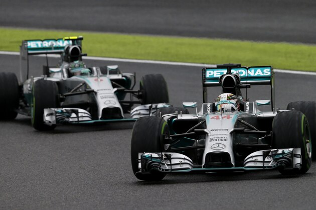 Mercedes driver Lewis Hamilton of Britain leads teammate Nico Rosberg of Germany during the Japanese Formula One Grand Prix at the Suzuka Circuit in Suzuka, central Japan, Sunday, Oct. 5, 2014. Hamilton won the race while Rosberg finished second. (AP Photo/Shuji Kajiyama)