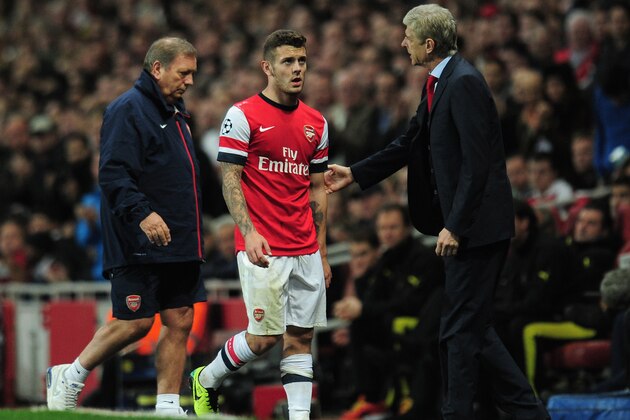 LONDON, ENGLAND - OCTOBER 22:  Manager Arsene Wenger of Arsenal ackowledges Jack Wilshere of Arsenal as he comes off with an injury during the UEFA Champions League Group F match between Arsenal and  Borussia Dortmund at Emirates Stadium on October 22, 2013 in London, England.  (Photo by Shaun Botterill/Getty Images)