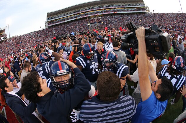 OXFORD, MS - OCTOBER 4: Fans of the Ole Miss Rebels rush the field to celebrate the victory over the Alabama Crimson Tide on OCTOBER 4, 2014 at Vaught-Hemingway Stadium in Oxford, Mississippi. Mississippi beat Alabama 23-17. (Photo by Joe Murphy/Getty Images)