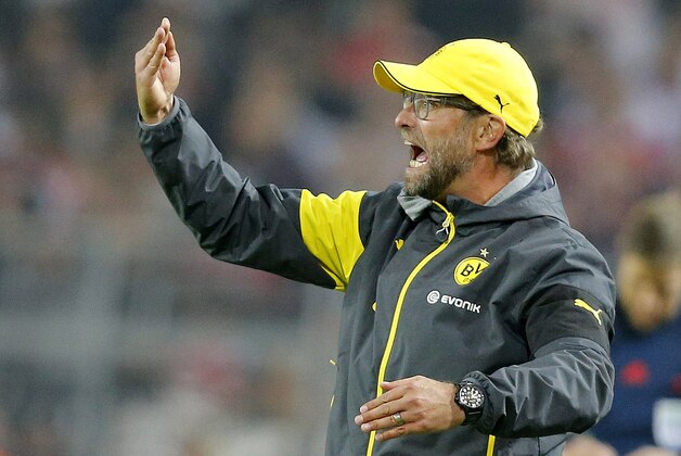 Dortmund's head coach Juergen Klopp gestures during the German first division Bundesliga soccer match between BvB Borussia Dortmund  and VfB Stuttgart in Dortmund, Germany, Wednesday, Sept. 24, 2014. (AP Photo/Frank Augstein)