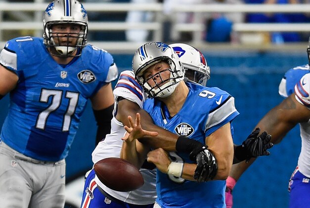 DETROIT, MI - OCTOBER 05: Matthew Stafford #9 of the Detroit Lions is sacked by Jerry Hughes #55 of the Buffalo Bills in the second quarter at Ford Field on October 05, 2014 in Detroit, Michigan. the Buffalo Bills win 17-14. (Photo by Joe Sargent/Getty Images)