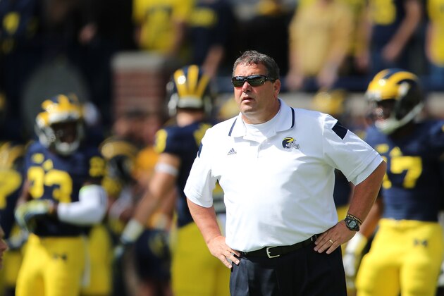 ANN ARBOR, MI - SEPTEMBER 13:  Head Football Coach Brady Hoke watches the warms up prior to the start of the game between the Miami University Redhawks and the Michigan Wolverines at Michigan Stadium on September 13, 2014 in Ann Arbor, Michigan. the Wolverines defeated the Redhawks 34-10.  (Photo by Leon Halip/Getty Images)