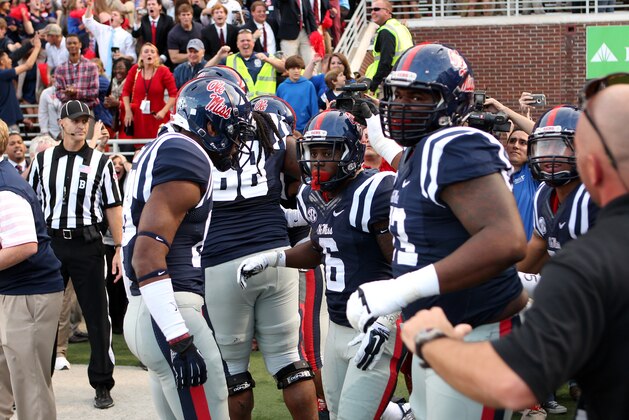 OXFORD, MS - OCTOBER 4: Jaylen Walton #6 of the Ole Miss Rebels celebrates his touchdown with teammates against the Alabama Crimson Tide on OCTOBER 4, 2014 at Vaught-Hemingway Stadium in Oxford, Mississippi. Mississippi beat Alabama 23-17. (Photo by Joe Murphy/Getty Images) OXFORD, MS - OCTOBER 4: Jaylen Walton #6 of the Ole Miss Rebels celebrates his touchdown with teammates against the Alabama Crimson Tide on OCTOBER 4, 2014 at Vaught-Hemingway Stadium in Oxford, Mississippi. Mississippi beat Alabama 23-17. (Photo by Joe Murphy/Getty Images)
