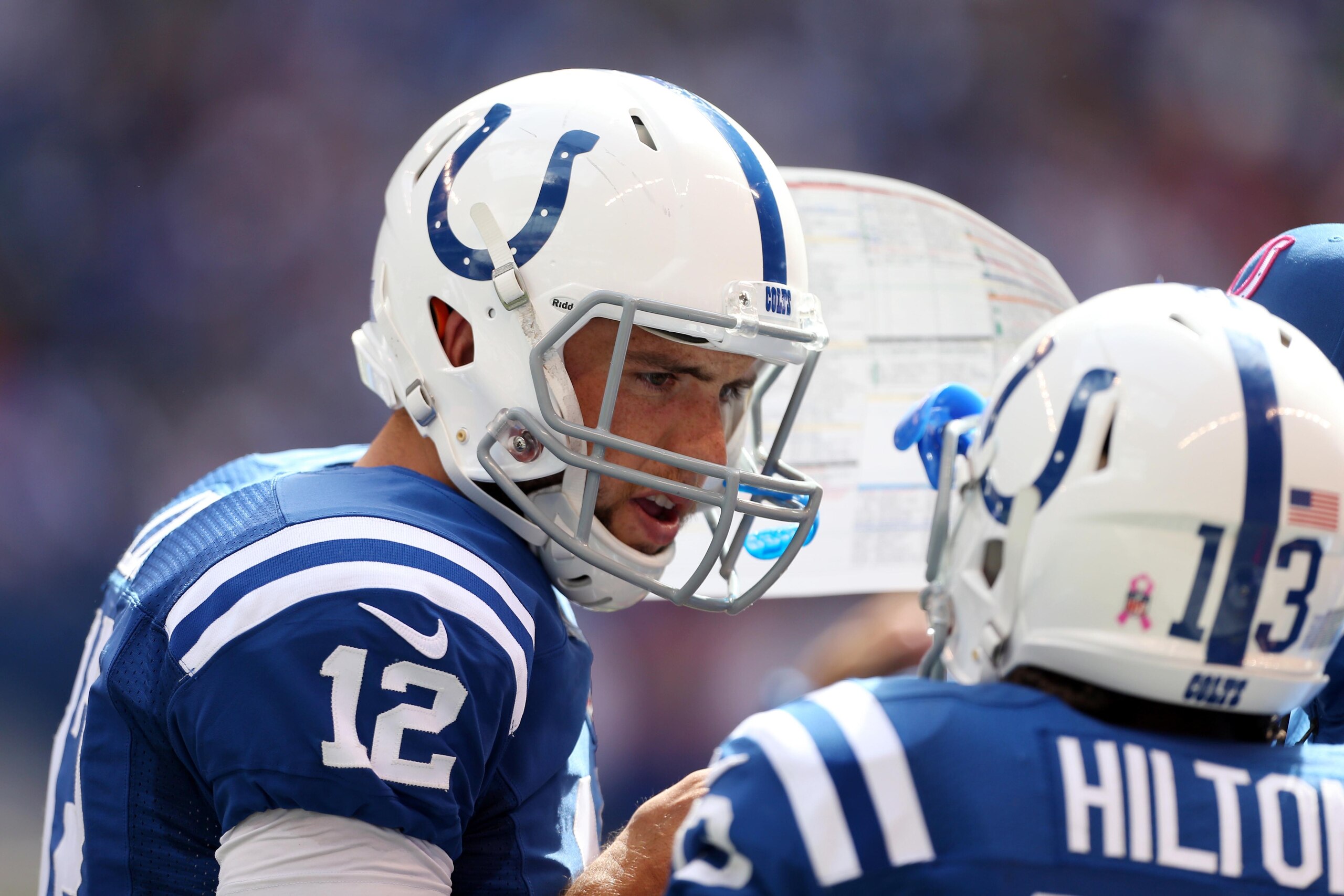 Oct 5, 2014; Indianapolis, IN, USA; Indianapolis Colts quarterback Andrew Luck (12) talks to wide receiver T.Y. Hilton (13) during a game against the Baltimore Ravens at Lucas Oil Stadium. Mandatory Credit: Brian Spurlock-USA TODAY Sports
