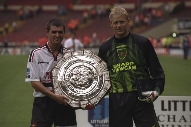 3 Aug 1997:  Roy Keane (left) and Peter Schmeichel of Manchester United hold the FA Charity Shield after victory against Chelsea at Wembley Stadium in London, England. The match was drawn 1-1 but Manchester United won 4-2 on penalty kicks. \ Mandatory Credit: Graham Chadwick /Allsport