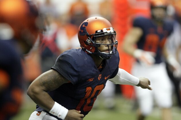 Syracuse’s Terrel Hunt looks down field in the third quarter of an NCAA college football game against Louisville  in Syracuse, N.Y., Friday, Oct. 3, 2014. (AP Photo/Nick Lisi)