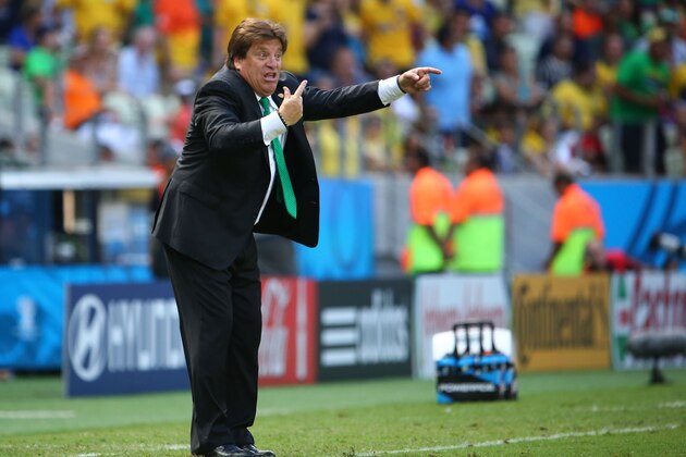 FORTALEZA, BRAZIL - JUNE 29: Head coach Miguel Herrera of Mexico reacts during the 2014 FIFA World Cup Brazil Round of 16 match between Netherlands and Mexico at Castelao on June 29, 2014 in Fortaleza, Brazil.  (Photo by Robert Cianflone/Getty Images)