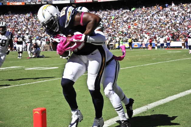 San Diego Chargers tight end Antonio Gates, left, scores on  New York Jets cornerback Antonio Allen during the first half of an NFL football game, Sunday, Oct. 5, 2014, in San Diego.  (AP Photo/Denis Poroy)