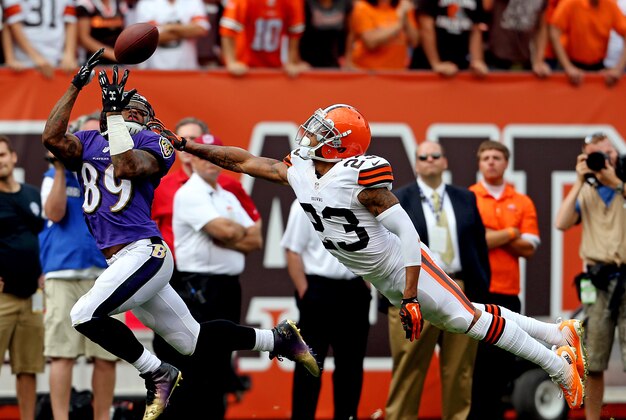 Sep 21, 2014; Cleveland, OH, USA; Baltimore Ravens wide receiver Steve Smith (89) makes a long reception against Cleveland Browns cornerback Joe Haden (23) during the fourth quarter at FirstEnergy Stadium. The Ravens won 23-21. Mandatory Credit: Ron Schwane-USA TODAY Sports