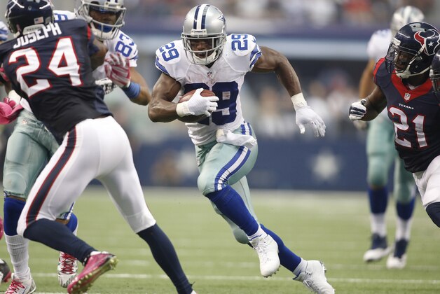 Oct 5, 2014; Arlington, TX, USA; Dallas Cowboys running back DeMarco Murray (29) runs the ball in the game against the Houston Texans  at AT&T Stadium. Dallas beat Houston 20-17 in overtime. Mandatory Credit: Tim Heitman-USA TODAY Sports