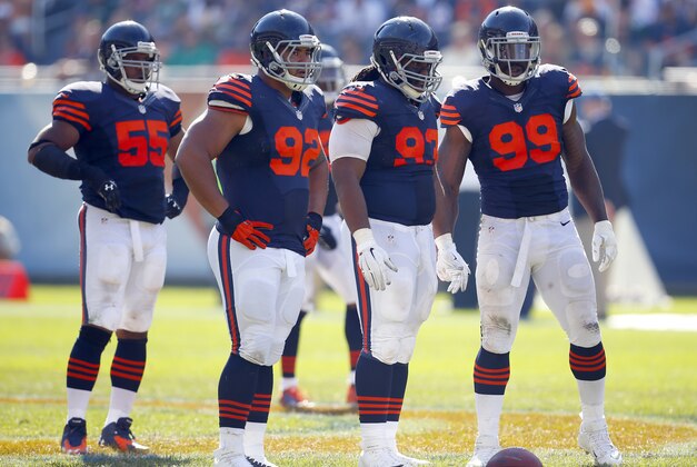 Chicago Bears outside linebacker Lance Briggs (55), defensive tackle Stephen Paea (92), defensive tackle Will Sutton (93) and defensive end Lamarr Houston (99) wait on the Green Bay Packers during an NFL game at Soldier Field in Chicago on Sunday, Sept. 28, 2014. (Jeff Haynes/AP Images for Panini)