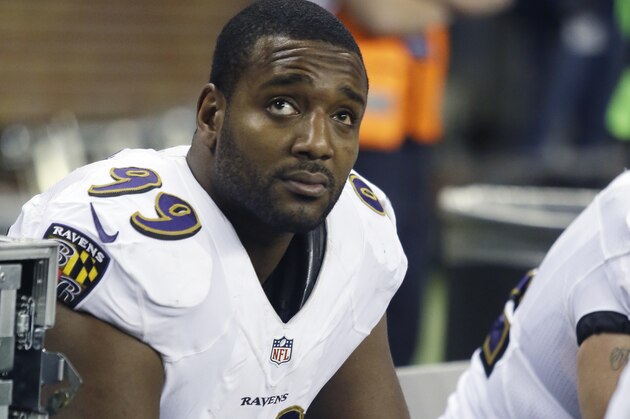 Baltimore Ravens defensive end Chris Canty (99) waits on the bench during the third quarter of an NFL football game against the Detroit Lions in Detroit, Monday, Dec. 16, 2013. (AP Photo/Duane Burleson)