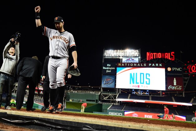 WASHINGTON, DC - OCTOBER 04:  Brandon Belt #9 of the San Francisco Giants celebrates after defeating the Washington Nationals in the eighteenth inning 2 to 1 in Game Two of the National League Division Series at Nationals Park on October 4, 2014 in Washington, DC.  (Photo by Patrick Smith/Getty Images)