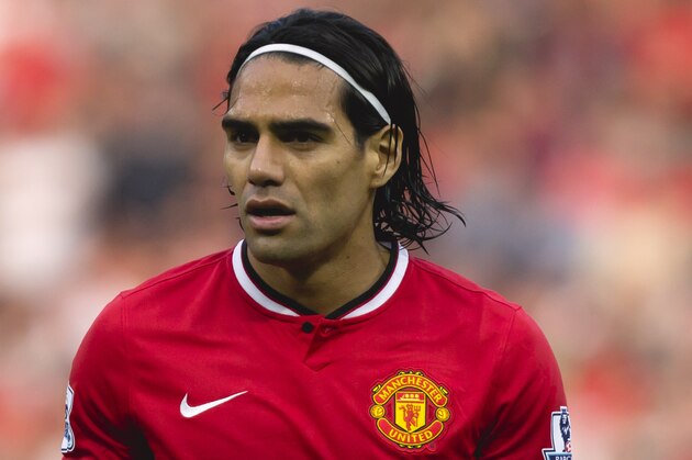 Manchester United's Radamel Falcao stands on the pitch during his team's English Premier League soccer match against Queens Park Rangers at Old Trafford Stadium, Manchester, England, Sunday Sept. 14, 2014. (AP Photo/Jon Super)