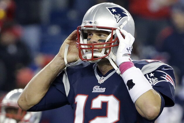 New England Patriots quarterback Tom Brady adjusts his helmet before an NFL football game against the Cincinnati Bengals Sunday, Oct. 5, 2014, in Foxborough, Mass. (AP Photo/Steven Senne)