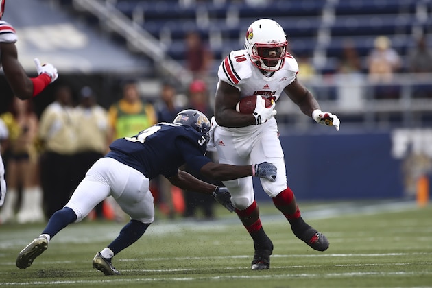 FIU's Richard Leonard (3) tries to tackle Louisville's Dominique Brown (10) during the first half of a NCAA college football game in Miami, Fla., Saturday, Sept. 20, 2014. (AP Photo/J Pat Carter) FIU's Richard Leonard (3) tries to tackle Louisville's Dominique Brown (10) during the first half of a NCAA college football game in Miami, Fla., Saturday, Sept. 20, 2014. (AP Photo/J Pat Carter)