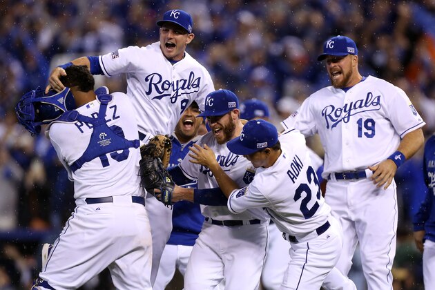 KANSAS CITY, MO - OCTOBER 05:  Greg Holland #56 celebrates with Norichika Aoki #23 of the Kansas City Royals after defeating the Los Angeles Angels 8-3 in Game Three of the American League Division Series at Kauffman Stadium on October 5, 2014 in Kansas City, Missouri.  (Photo by Ed Zurga/Getty Images)