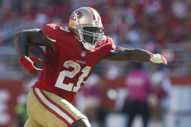 San Francisco 49ers running back Frank Gore (21) runs against the Kansas City Chiefs during the fourth quarter of an NFL football game in Santa Clara, Calif., Sunday, Oct. 5, 2014. (AP Photo/Tony Avelar)