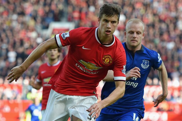 MANCHESTER, ENGLAND - OCTOBER 05:  Steven Naismith of Everton competes with Patrick McNair of Manchester United during the Barclays Premier League match between Manchester United and Everton at Old Trafford on October 5, 2014 in Manchester, England.  (Photo by Michael Regan/Getty Images)