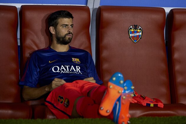 VALENCIA, SPAIN - SEPTEMBER 21:  Gerard Pique of Barcelona watches from the subsitute bench prior to the La Liga match between Levante UD and FC Barcelona at Ciutat de Valencia on September 21, 2014 in Valencia, Spain.  (Photo by Manuel Queimadelos Alonso/Getty Images)