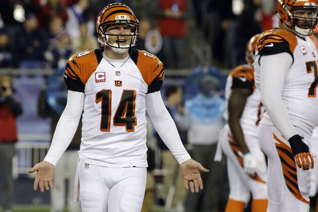 Cincinnati Bengals quarterback Andy Dalton (14) reacts after throwing an incomplete pass in the first half of an NFL football game against the New England Patriots Sunday, Oct. 5, 2014, in Foxborough, Mass. (AP Photo/Stephan Savoia)