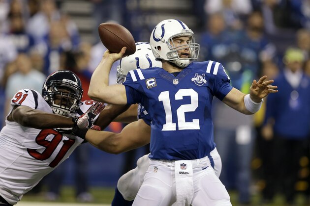 Indianapolis Colts quarterback Andrew Luck (12) throws under pressure from Houston Texans linebacker Ricky Sapp during the first half of an NFL football game in Indianapolis, Sunday, Dec. 15, 2013. (AP Photo/Darron Cummings)