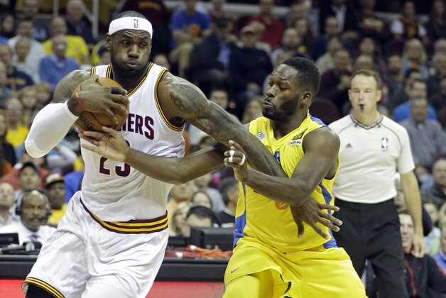 Cleveland Cavaliers' LeBron James (23) drives past Maccabi Tel Aviv's Jeremy Pargo in the first quarter of a preseason exhibition basketball game Sunday, Oct. 5, 2014, in Cleveland. (AP Photo/Mark Duncan)
