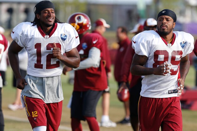 Aug 10, 2014; Richmond, VA, USA; Washington Redskins wide receiver Andre Roberts (12) and Redskins wide receiver Santana Moss (89) run on the field during practice on day eighteen of training camp at Bon Secours Washington Redskins Training Center. Mandatory Credit: Geoff Burke-USA TODAY Sports Aug 10, 2014; Richmond, VA, USA; Washington Redskins wide receiver Andre Roberts (12) and Redskins wide receiver Santana Moss (89) run on the field during practice on day eighteen of training camp at Bon Secours Washington Redskins Training Center. Mandatory Credit: Geoff Burke-USA TODAY Sports