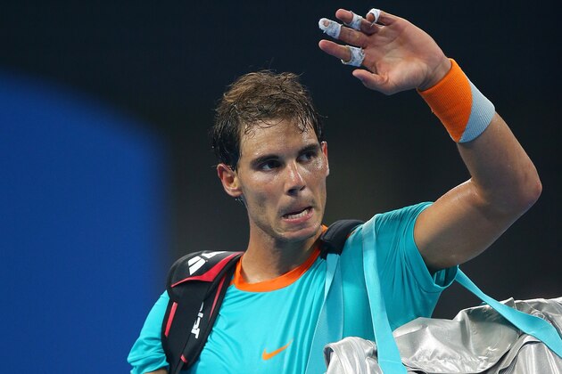 BEIJING, CHINA - OCTOBER 03:  Rafael Nadal of Spain leaves the court after losing his match against Martin Klizan of Slovakia during during day seven of the China Open at the National Tennis Center on October 3, 2014 in Beijing, China.  (Photo by Chris Hyde/Getty Images)
