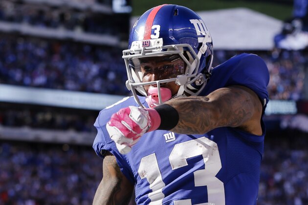 El wide receiver Odell Beckham de los Giants de Nueva York celebra tras recibir un pase de touchdown del quarterback Eli Manning en el partido de la NFL ante los Falcons de Atlanta, el domingo 5 de octubre de 2014. (AP Foto/Seth Wenig)