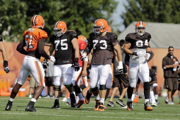 Cleveland Browns offensive linemen Joel Bitonio (75), Joe Thomas (73) and tight end Jordan Cameron (84) come to the line during practice at NFL football training camp in Berea, Ohio Friday, Aug. 15, 2014. (AP Photo/Mark Duncan)