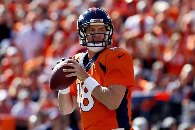 Denver Broncos quarterback Peyton Manning (18) get ready to throw his 500th career touchdown pass during the first half of an NFL football game against the Arizona Cardinals, Sunday, Oct. 5, 2014, in Denver. (AP Photo/Joe Mahoney)