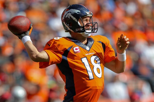 DENVER, CO - OCTOBER 5:  Quarterback Peyton Manning #18 of the Denver Broncos passes against the Arizona Cardinals in the second quarter of a game at Sports Authority Field at Mile High on October 5, 2014 in Denver, Colorado.  (Photo by Justin Edmonds/Getty Images)