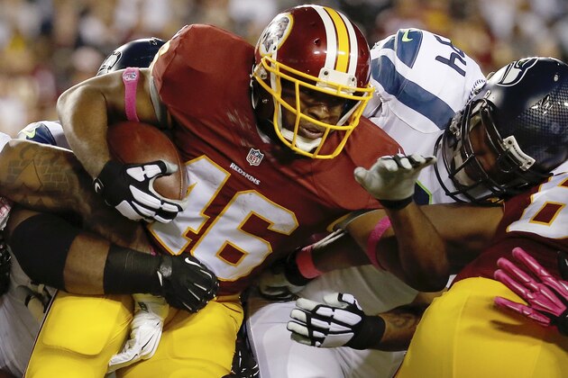 Washington Redskins running back Alfred Morris (46) carries the ball during the first half of an NFL football game against the Seattle Seahawks in Landover, Md., Monday, Oct. 6, 2014. (AP Photo/Alex Brandon)