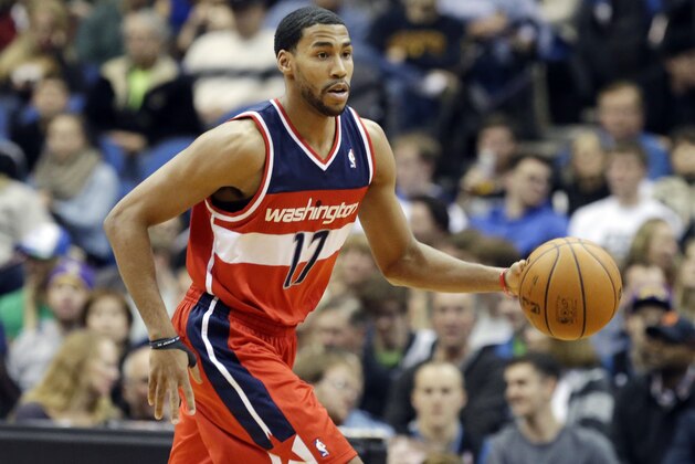 Washington Wizards' Garrett Temple dribbles the ball in the second half of an NBA basketball game against the Minnesota Timberwolves, Friday, Dec. 27, 2013, in Minneapolis. The Timberwolves won 120-98. (AP Photo/Jim Mone)
