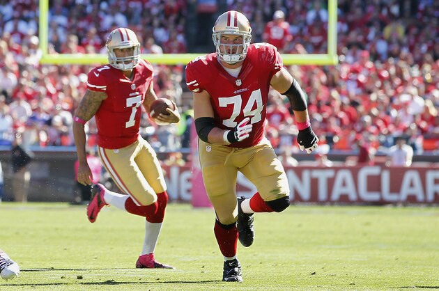 San Francisco 49ers offensive tackle Joe Staley (74) blocks for quarterback Colin Kaepernick (7) during the first half of an NFL football game against the Buffalo Bills in San Francisco, Sunday, Oct. 7, 2012. (AP Photo/Tony Avelar)