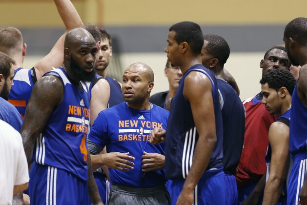 New York Knicks basketball  coach Derek Fisher talks to players during practice at the team's NBA training camp at the U.S. Military Academy on Tuesday, Sept. 30, 2014, in West Point, N.Y. (AP Photo/Mike Groll)