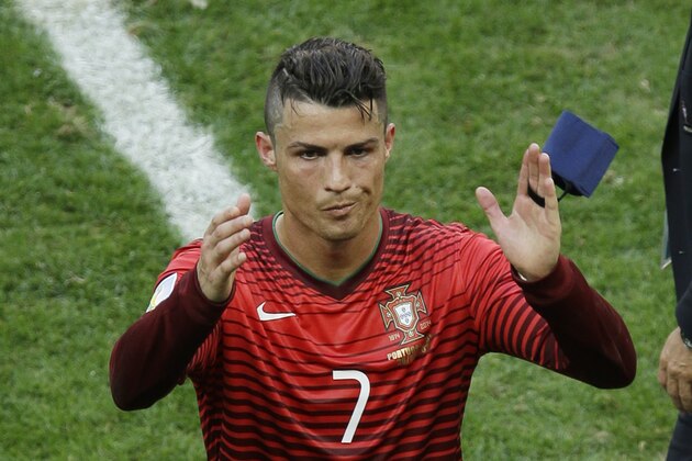 Portugal's Cristiano Ronaldo waves as he leaves the pitch following the group G World Cup soccer match between Portugal and Ghana at the Estadio Nacional in Brasilia, Brazil, Thursday, June 26, 2014. Portugal won 2-1. (AP Photo/Themba Hadebe)