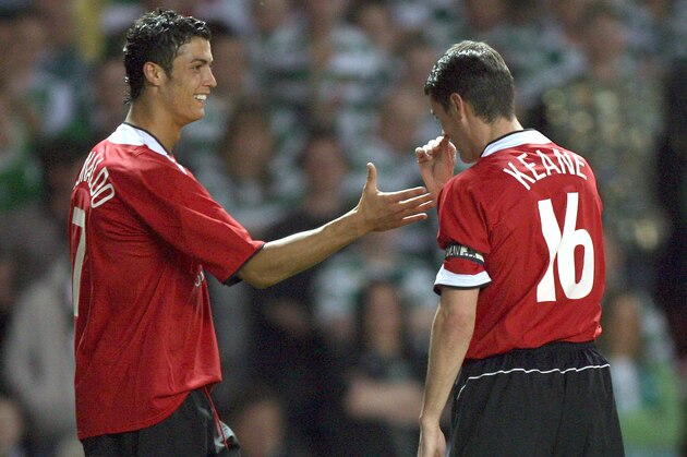 Former Manchester United captain Roy Keane, right, thumbs his nose at his former teammate Cristiano Ronaldo after Ronaldo's goal against Celtic during a testimonial soccer match for Keane at Old Trafford Stadium, Manchester, England, Tuesday May 9, 2006. (AP Photo/Jon Super)