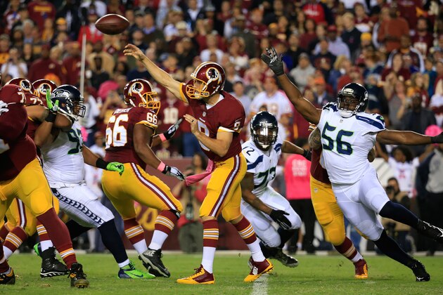LANDOVER, MD - OCTOBER 06:  Kirk Cousins #8 of the Washington Redskins throws against the Seattle Seahawks at FedExField on October 6, 2014 in Landover, Maryland.  (Photo by Rob Carr/Getty Images)
